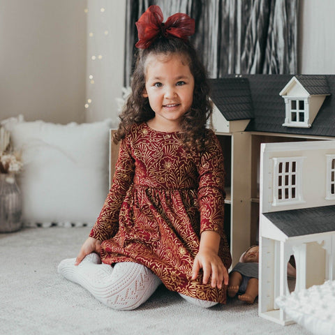 US stockist of Karibou Kids white Angel cotton and lace dress.  Beautifully detailed embroided cotton with lace trim on the ruffle sleeves and hem.  Invisible zip at side for easy dressing.