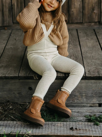 US stockist of Grown Clothing organic cotton gold frill overalls and cream cable knit sweater