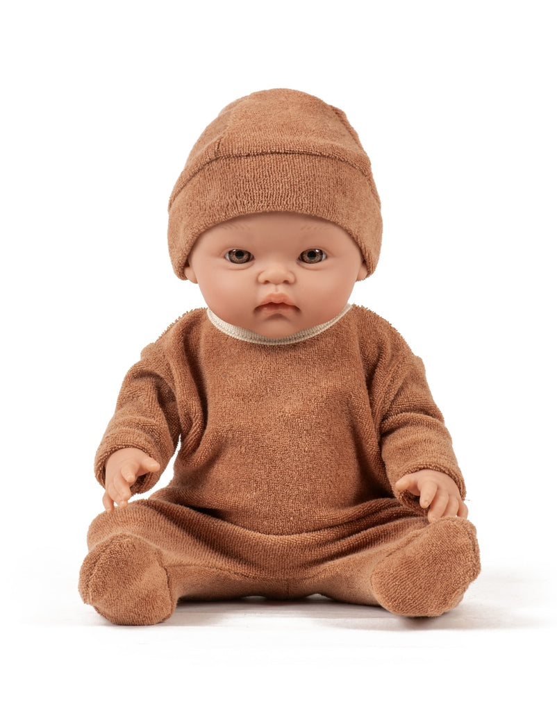 US stockist of Minikane's Octave Cuties doll dressed in Brown Sugar sleepsuit with matching Tico hat.